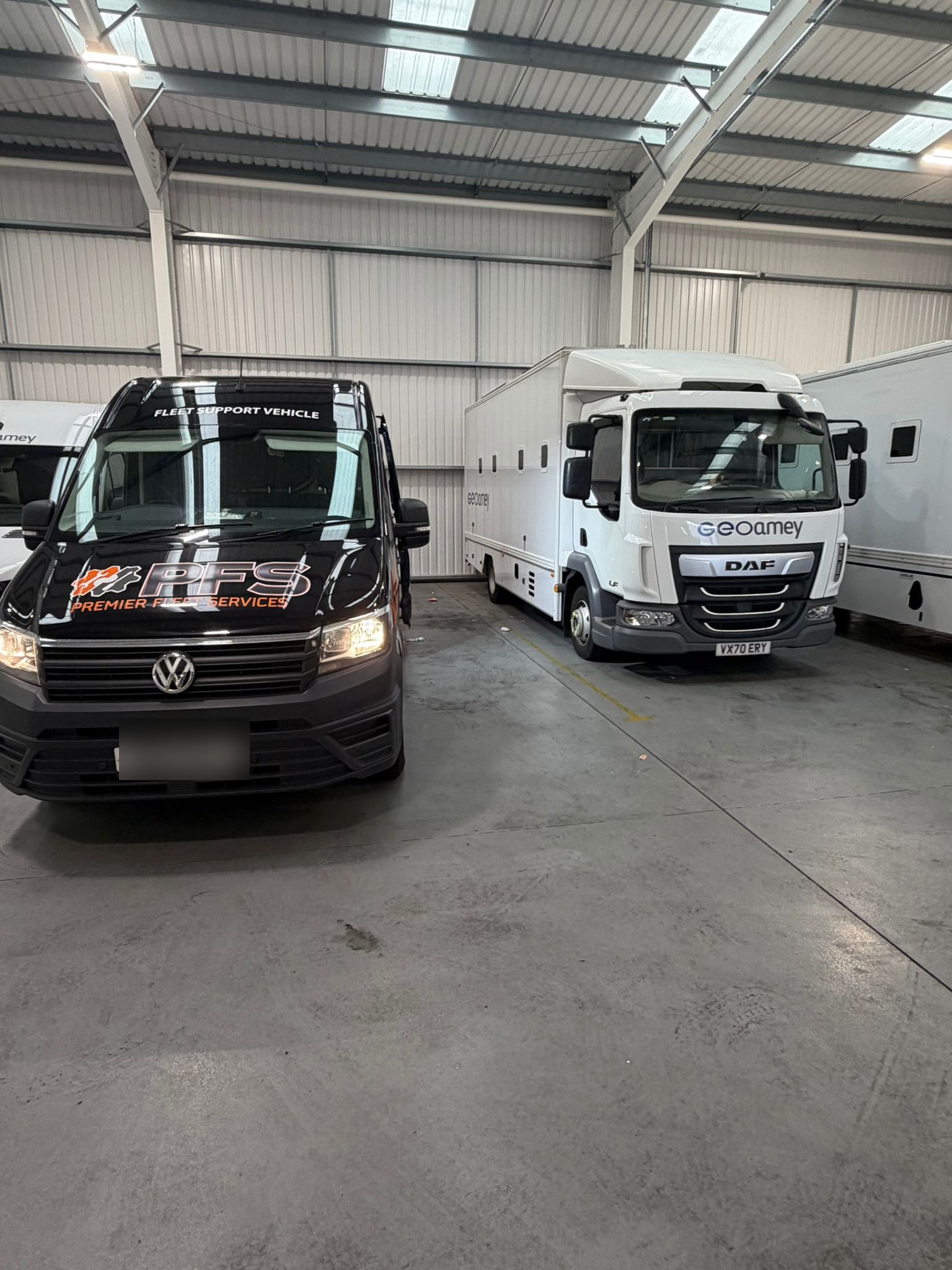 PFS Fleet Support Vehicle parked in the workshop alongside a client vehicle