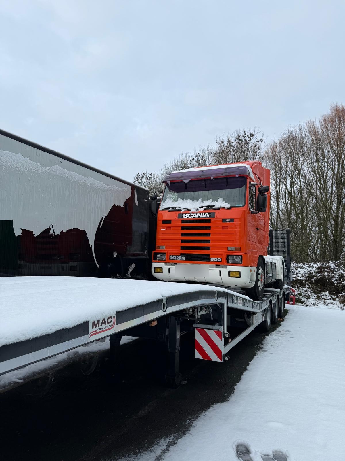 PFS low loader collecting a Scania tractor unit