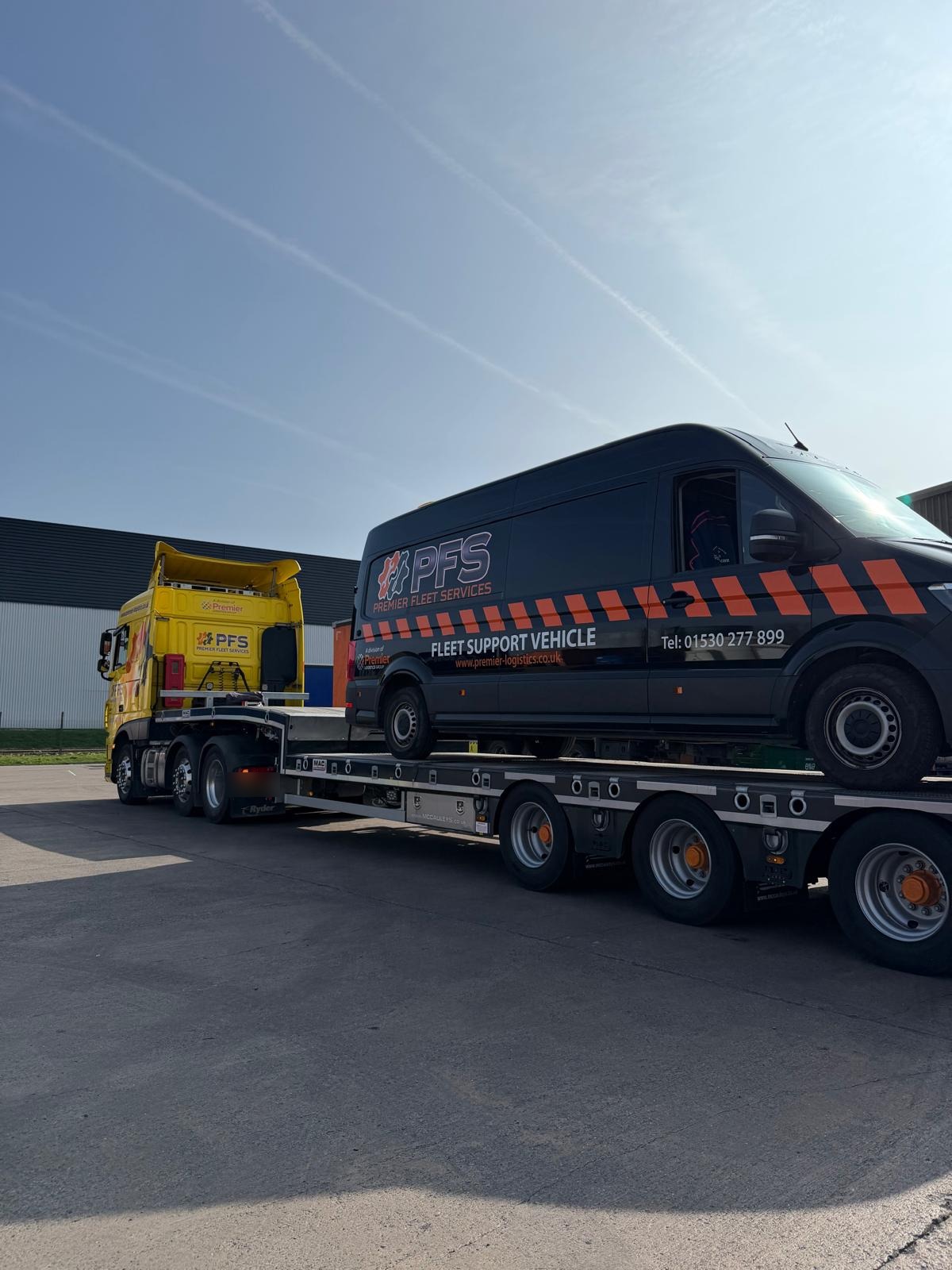 PFS low loader transporting a PFS Fleet Support Vehicle